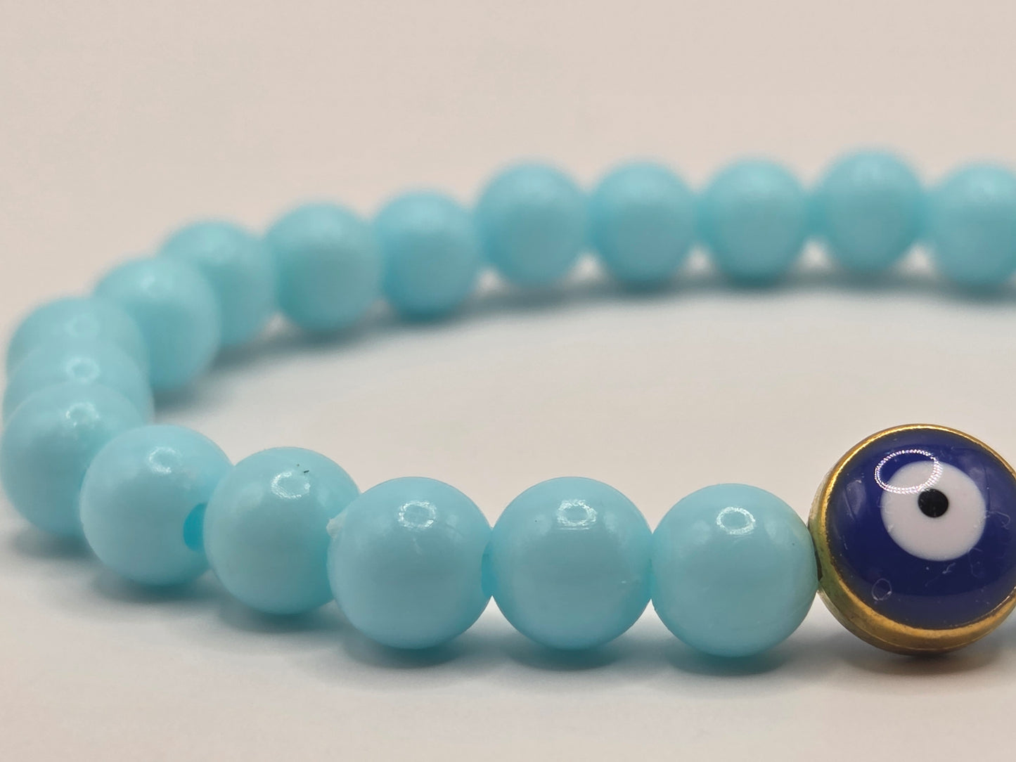 Light blue bracelet with Evil Eye – lightness & protection in soft tones