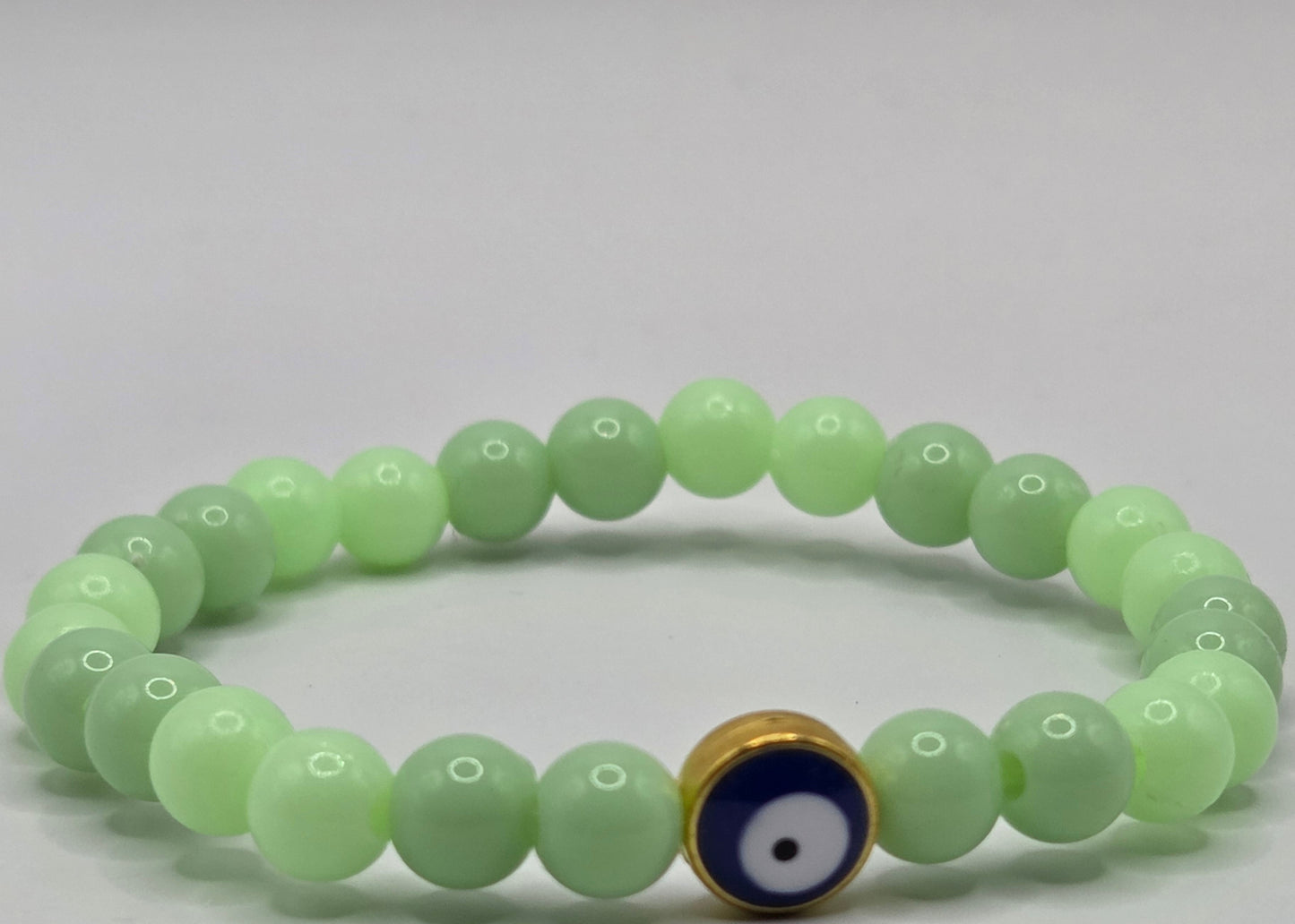 Green bracelet with Evil Eye