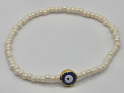 Beige bracelet with Evil Eye
