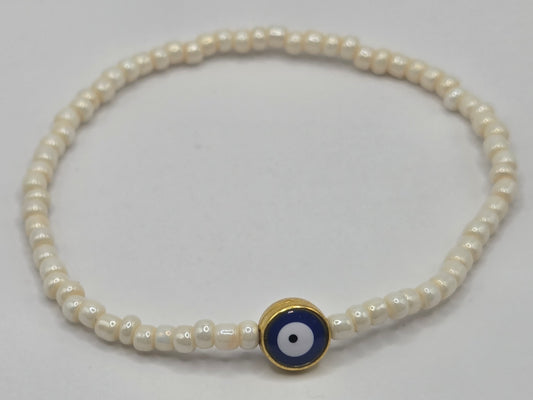 Beige bracelet with Evil Eye