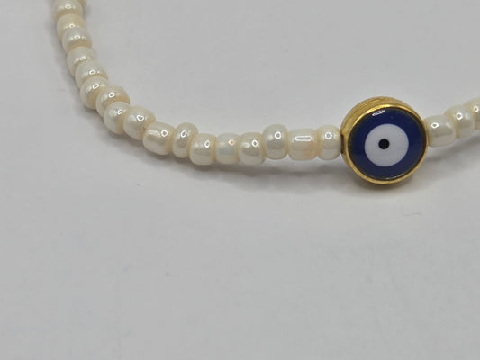 Beige bracelet with Evil Eye