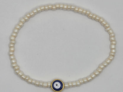 Beige bracelet with Evil Eye