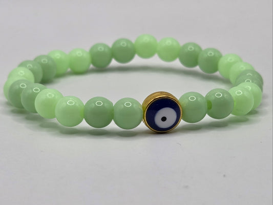 Green bracelet with Evil Eye