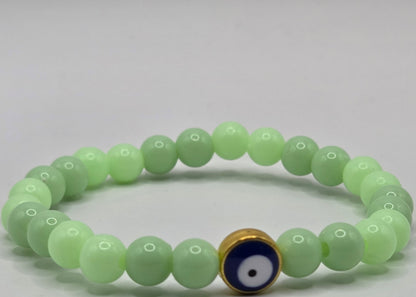 Green bracelet with Evil Eye