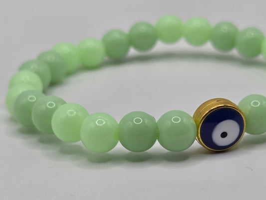 Green bracelet with Evil Eye