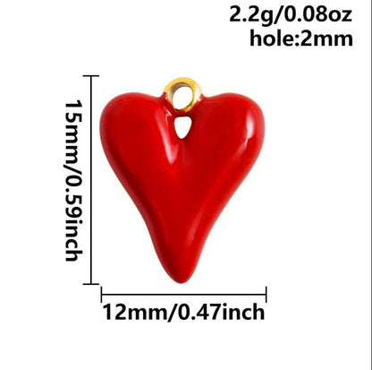 Heart-shaped charm with gold loop