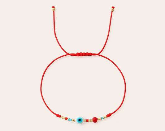 Geflochtenes Armband mit Muschel-Auge – Boho Glücksarmband im Ibiza-Stil