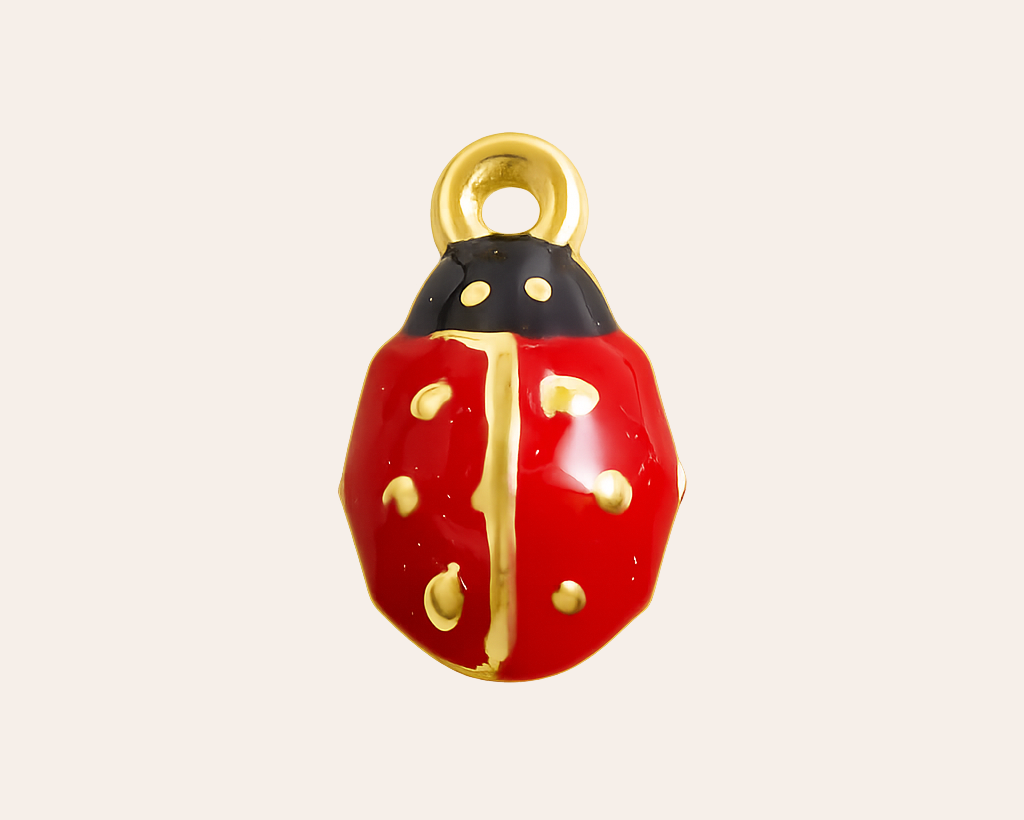 Shiny ladybug charm with gold accents