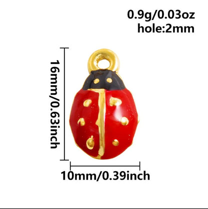 Shiny ladybug charm with gold accents